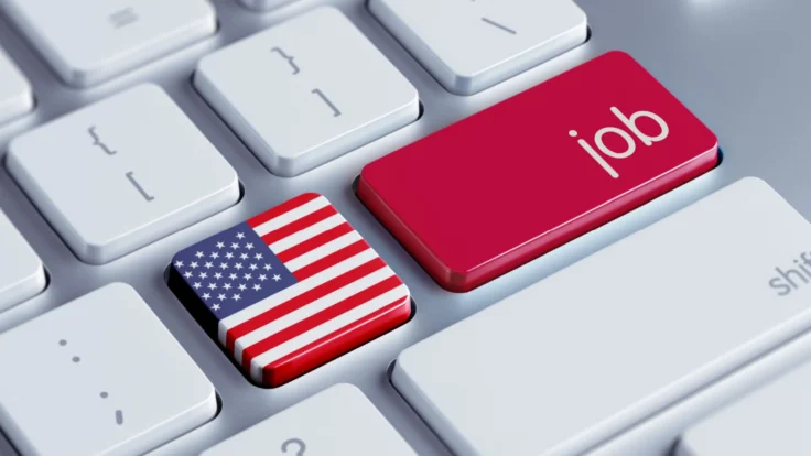 a computer keyboard with a red button with the american flag on it.